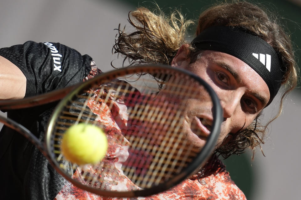 Greece's Stefanos Tsitsipas plays a shot against Spain's Roberto Carballes Baena during their second round match of the French Open tennis tournament at the Roland Garros stadium in Paris, Wednesday, May 31, 2023. (AP Photo/Christophe Ena)