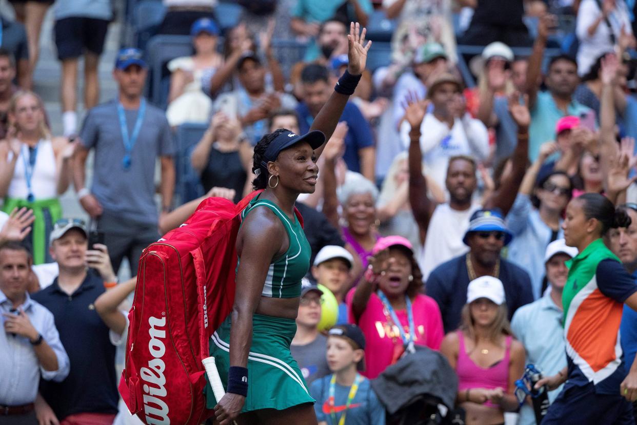 Venus Williams of the U.S. waves to the crowd after losing to Alison van Uytvanck of Belgium in a 2022 U.S. Open Tennis tournament women's singles first round match at the USTA Billie Jean King National Tennis Center in New York on Aug. 30, 2022.