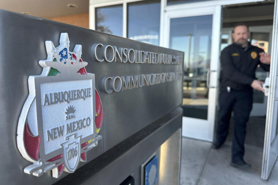 An officer leaves the city's Real Time Crime Center following a news conference on Dec. 15, 2023, in Albuquerque, N.M. Officials are seeking more funding from the New Mexico Legislature to add cameras and expand access to neighboring communities. (AP Photo/Susan Montoya Bryan)