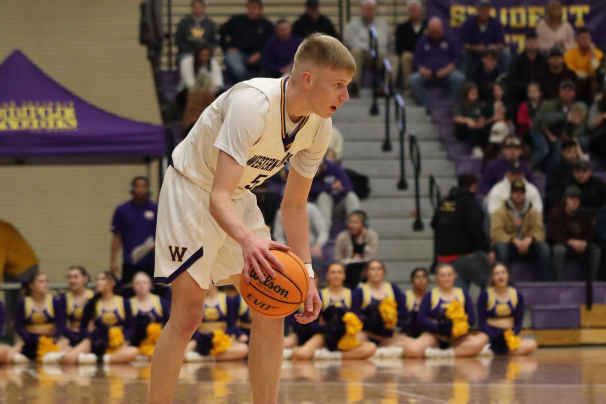 Western Illinois men's basketball player Trenton Massner dribbles during a game Thursday against South Dakota.