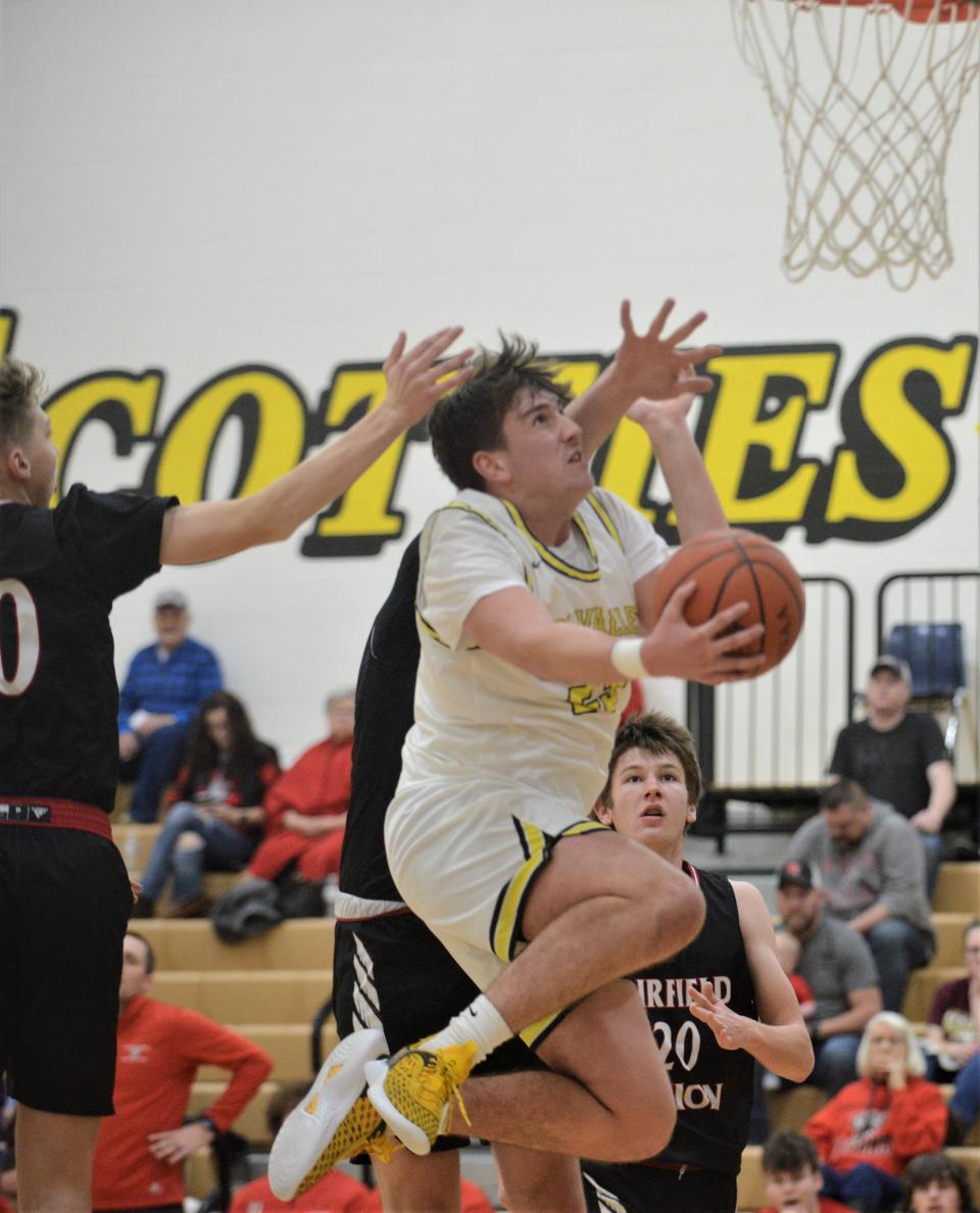 Tri-Valley's Max Lyall fights through traffic for a layup against Fairfield Union on Thursday. The Scotties won 54-49.