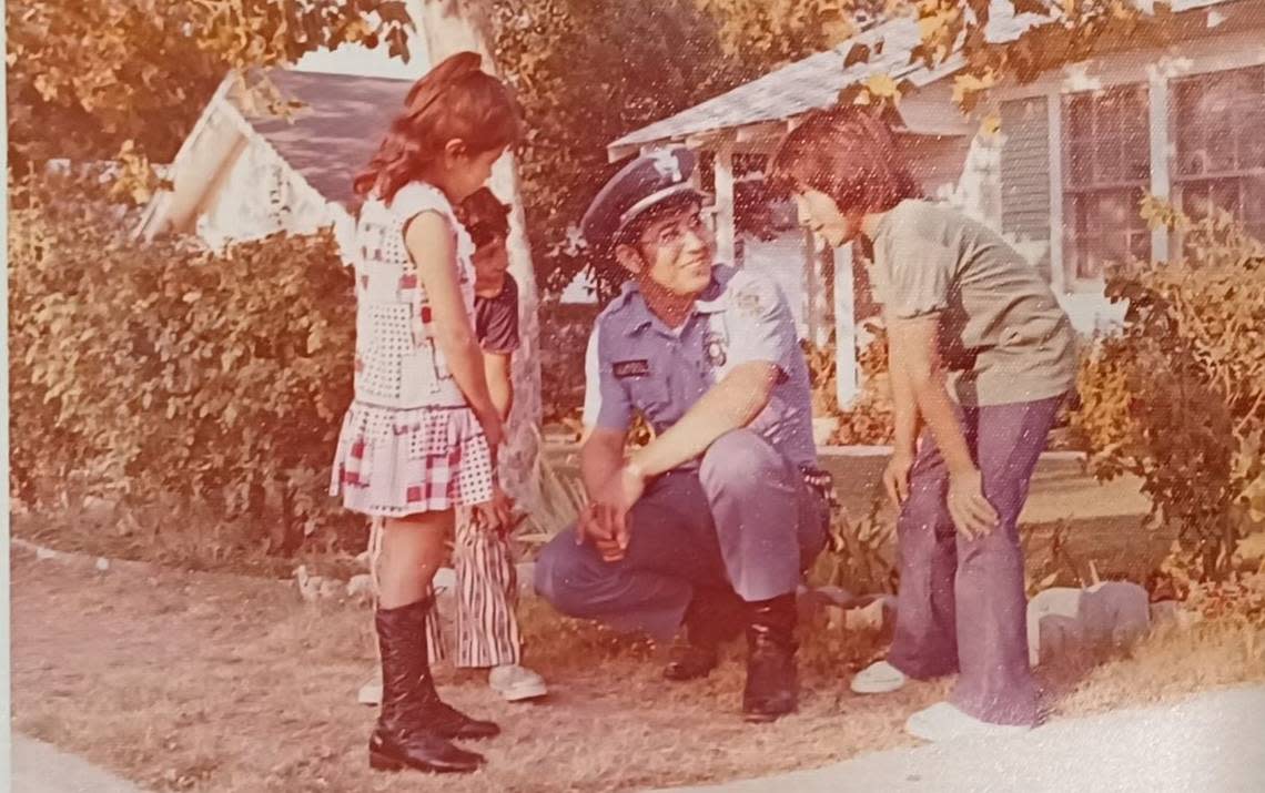 Fort Worth police officer Rufino Mendoza Jr. worked in the Community Service Division. He is speaking here with Worth Heights youth in 1973.