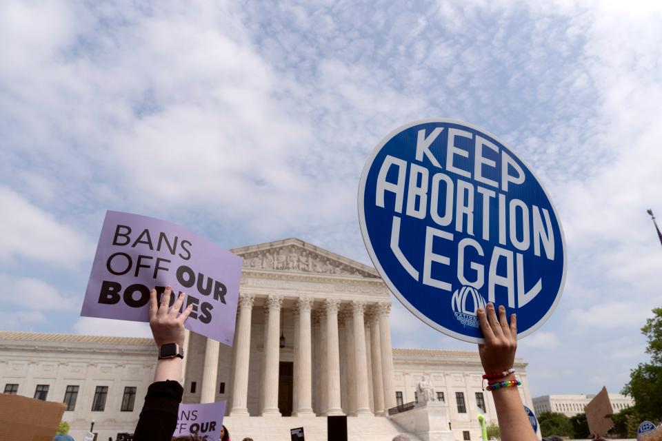 Demonstrators protest outside of the Supreme Court Tuesday, May 3, 2022 in Washington. A draft opinion suggests the U.S. Supreme Court could be poised to overturn the landmark 1973 Roe v. Wade case that legalized abortion nationwide.