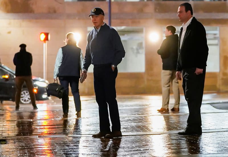 U.S. President Biden reacts to a vehicle crashing into a Secret Service SUV that was blocking the street, in Wilmington