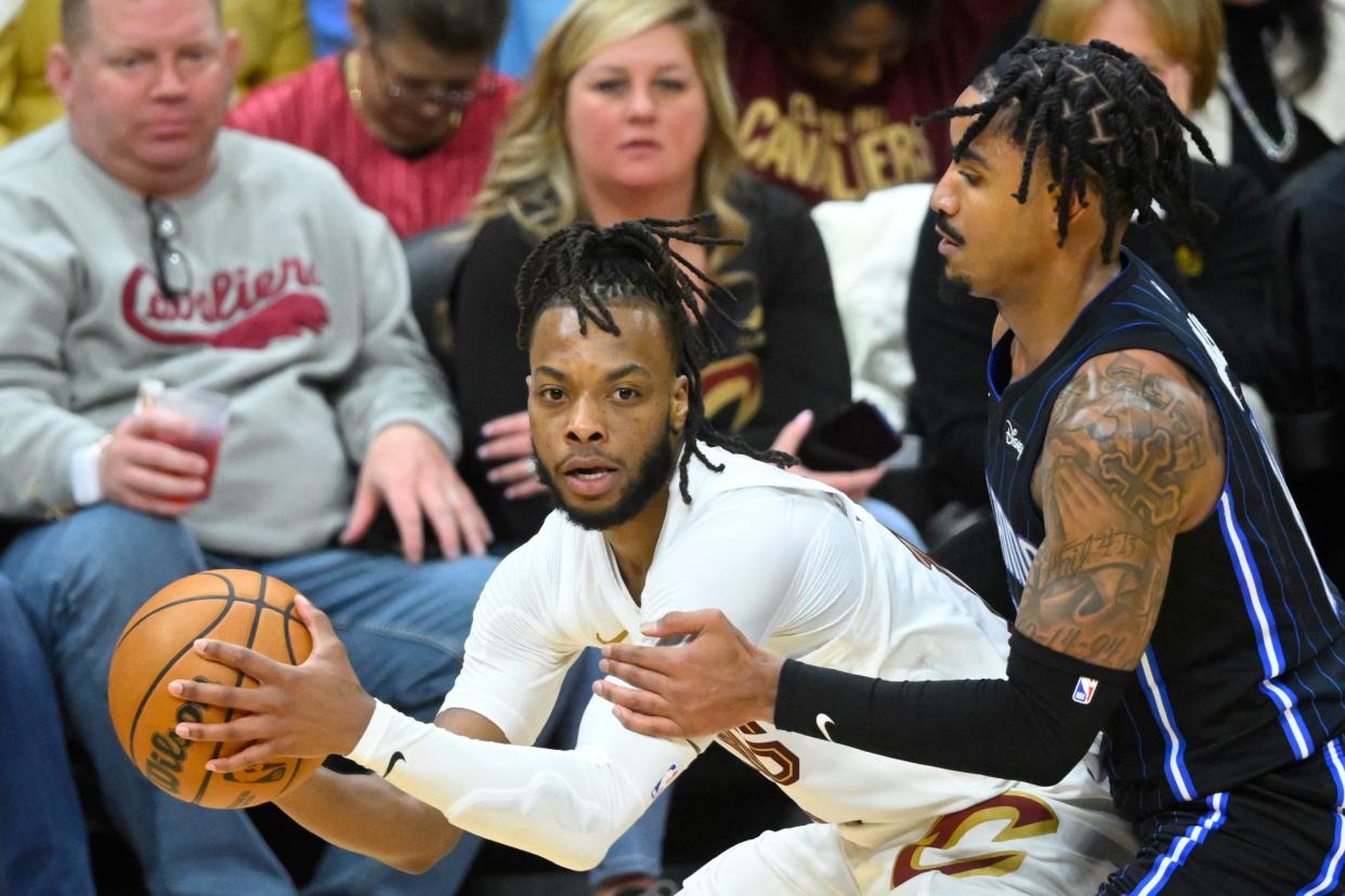 Apr 20, 2024; Cleveland, Ohio, USA; Cleveland Cavaliers guard Darius Garland (10) looks to pass beside Orlando Magic guard Gary Harris (14) in the third quarter during game one of the first round for the 2024 NBA playoffs at Rocket Mortgage FieldHouse. Mandatory Credit: David Richard-USA TODAY Sports