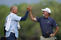 Jerry Kelly celebrates with his caddie Eric Meller, left, after winning the PGA Tour Champions Principal Charity Classic golf tournament, Sunday, June 5, 2022, in Des Moines, Iowa. (AP Photo/Charlie Neibergall)