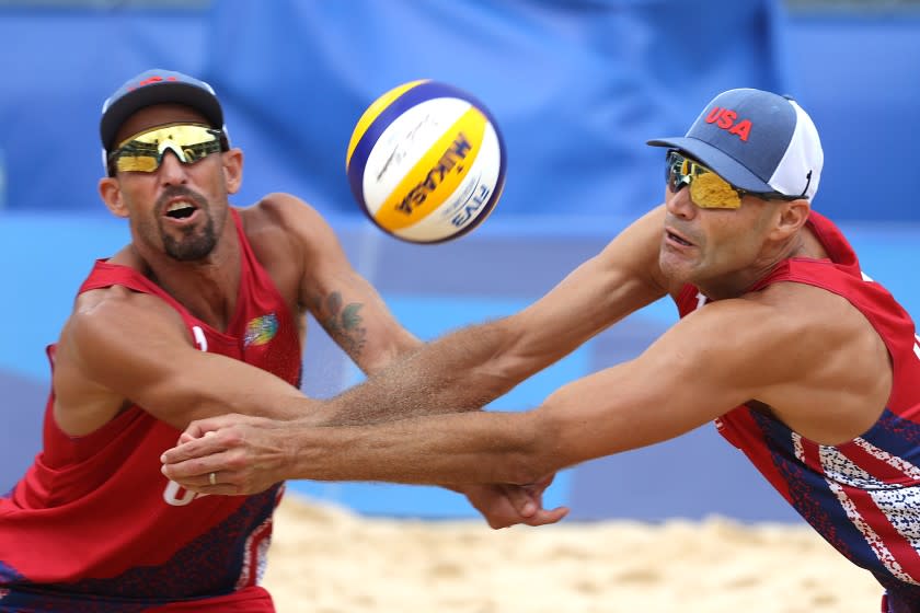 TOKYO, JAPAN - JULY 27: Philip Dalhausser #1 of Team United States and Nicholas Lucena #2 look on against Team Brazil during the Men's Preliminary - Pool D beach volleyball on day four of the Tokyo 2020 Olympic Games at Shiokaze Park on July 27, 2021 in Tokyo, Japan. (Photo by Sean M. Haffey/Getty Images)