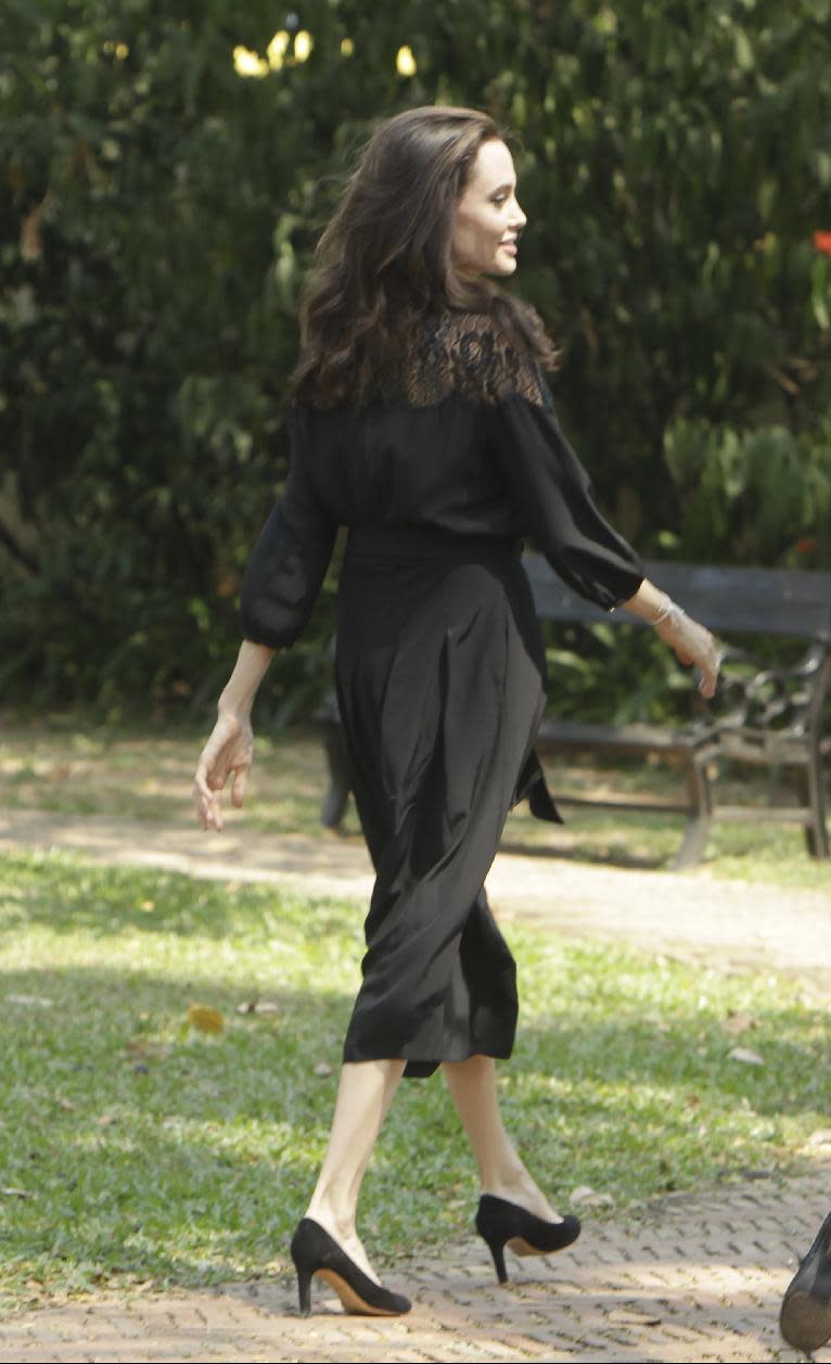 Hollywood actress Angelina Jolie walks away after a press conference in Siem Reap, Cambodia, Saturday, Feb. 18, 2017. Jolie on Saturday launches her two-day film screening of "First They Killed My Father" in the Angkor complex in Siem Reap province. (AP Photo/Heng Sinith)