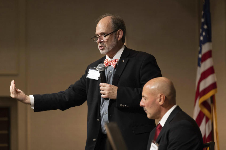 Douglas Frank, left, speaks during a panel discussion next to Robert Borer at the Nebraska Election Integrity Forum on Saturday, Aug. 27, 2022, in Omaha, Neb. (AP Photo/Rebecca S. Gratz)