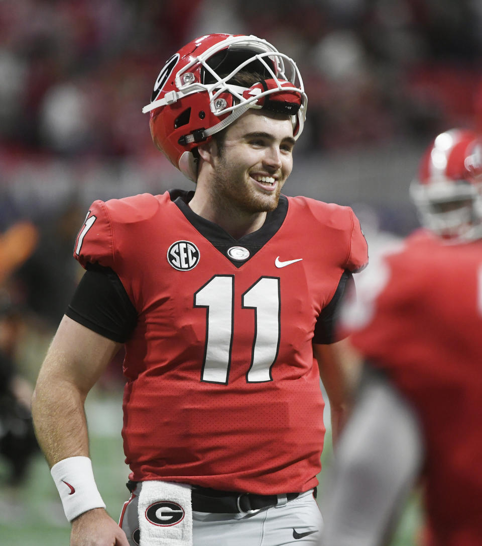 FILE - In this Dec. 1, 2018, file photo, Georgia quarterback Jake Fromm warms up before the Southeastern Conference championship NCAA college football game against Alabama in Atlanta. This year, a group of talented and experienced quarterbacks could help the SEC produce a little more drama. Georgia’s Fromm, LSU’s Joe Burrow, Florida’s Feleipe Franks and Texas A&M’s Kellen Mond are among the biggest reasons all those teams feel they have a realistic chance of knocking Alabama off its title perch. (AP Photo/John Amis, File)