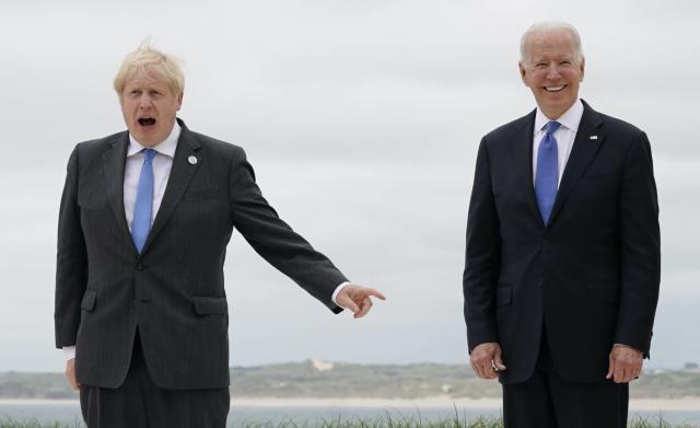 Boris Johnson laments G-7 'media circus' as grinning Biden looks on
