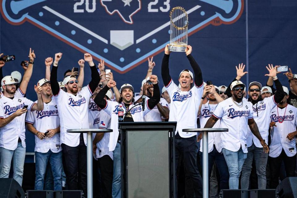Rangers shortstop Corey Seager holds up the World Series Trophy during their Championship Ceremony at the Texas Live! Plaza in Arlington on Friday, Nov. 3, 2023. Chris Torres/ctorres@star-telegram.com