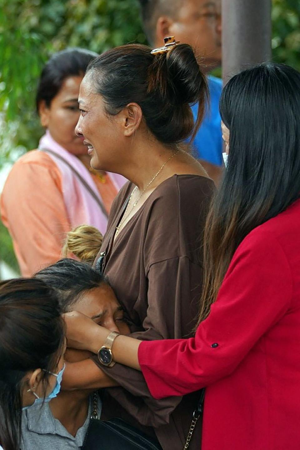 Family members and relatives of passengers on board the Twin Otter aircraft operated by Tara Air weep outside the airport in Pokhara (AFP via Getty Images/Yunish Gurung)