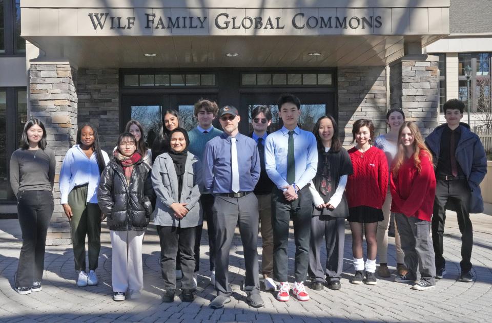 Dr. Seth Holm, chair of modern classics at the Hun School, leads volunteer students who talk with Afghan girls by phone to teach them English. Here is the class in front of the Hun School in Princeton, New Jersey, on Feb. 14, 2023.