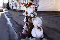 Stuffed animals, plastic flowers and rest-in-peace notes are displayed at a memorial for five-year-old Harmony Montgomery, outside her father's former home, Thursday, Feb. 8, 2024, in Manchester, N.H. During testimony in court Thursday, a prosecutor stated Adam Montgomery, Harmony's father, brutally beat the child to death and spent months moving her body around before disposing of it "like yesterday's trash." (AP Photo/Charles Krupa)