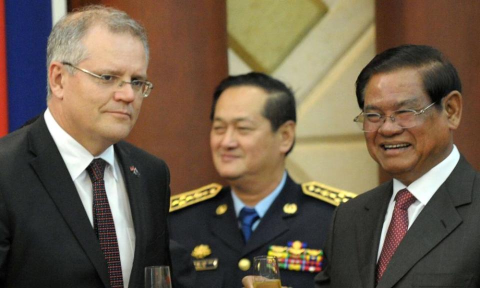 Scott Morrison, the then immigration minister, and Cambodia’s interior minister, Sar Kheng, sharing a toast in Phnom Penh. The Australian government has been asked to intervene to prevent the deportation of refugees from Cambodia.