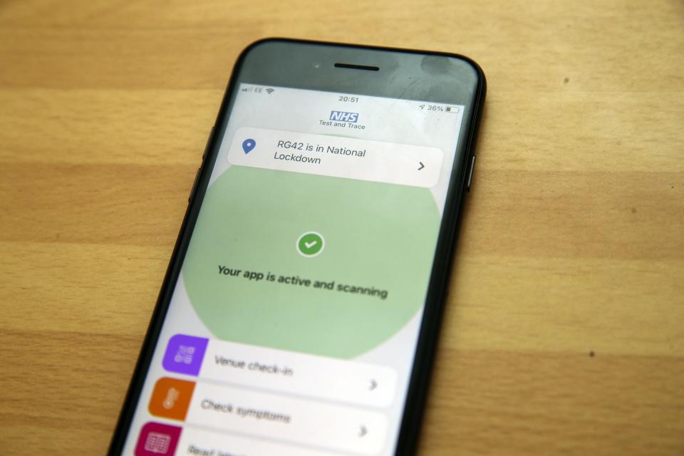 The NHS app on a smartphone (PA Wire)