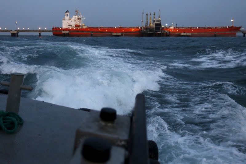 FILE PHOTO: An oil tanker is docked while oil is pumped into it at the ships terminal of PDVSA's Jose Antonio Anzoategui industrial complex in the state of Anzoategui