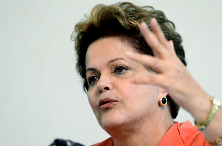 Brazilian President Dilma Rousseff gestures during a press conference at Granja do Torto presidential residence, following a cabinet meeting in Brasilia on July 1, 2013. Brazil's Congress has received a request from President Dilma Rousseff to hold a referendum on political reform in response to the worst social unrest in 20 years