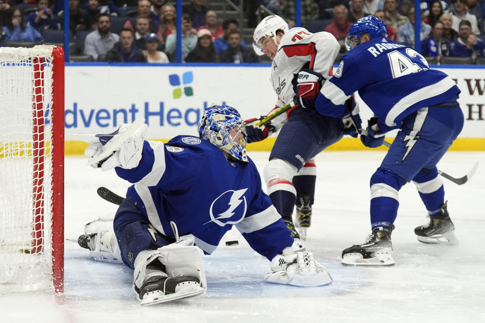 Tampa Bay Lightning goaltender Andrei Vasilevskiy (88) makes a save on a shot by Washington Capitals right wing T.J. Oshie (77) during the first period of an NHL hockey game Thursday, Feb. 22, 2024, in Tampa, Fla. (AP Photo/Chris O'Meara)