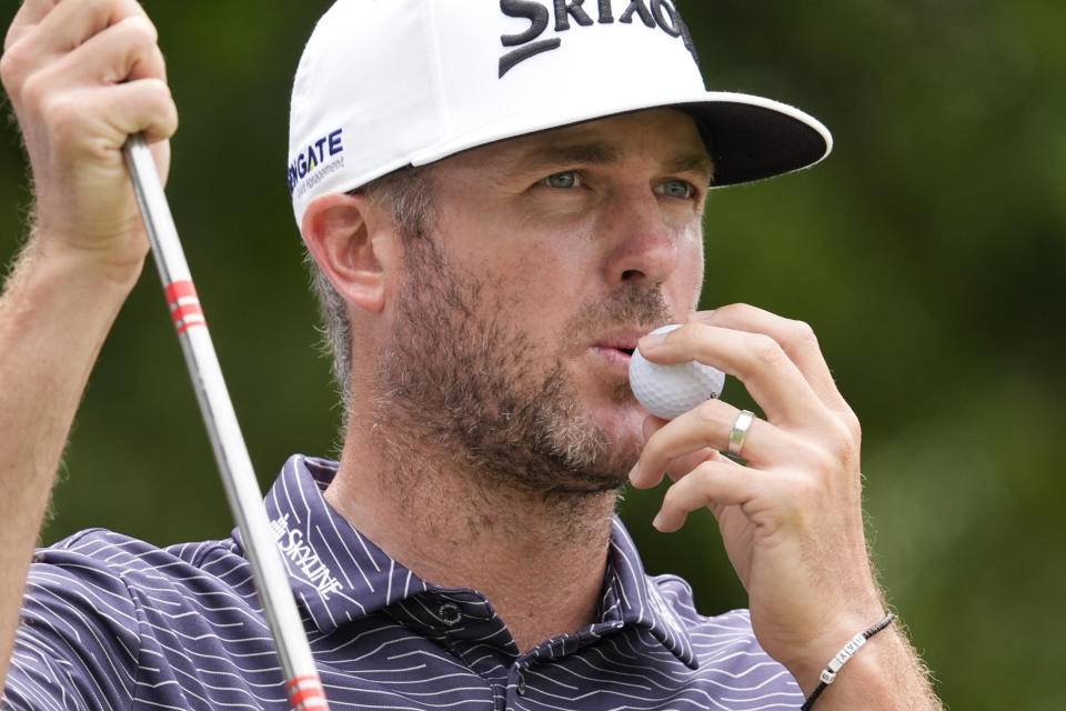 Taylor Pendrith blows on his golf ball before setting up for his tee shot on the fourth hole during the final round of the Byron Nelson golf tournament in McKinney, Texas, Sunday, May 5, 2024. (AP Photo/LM Otero)