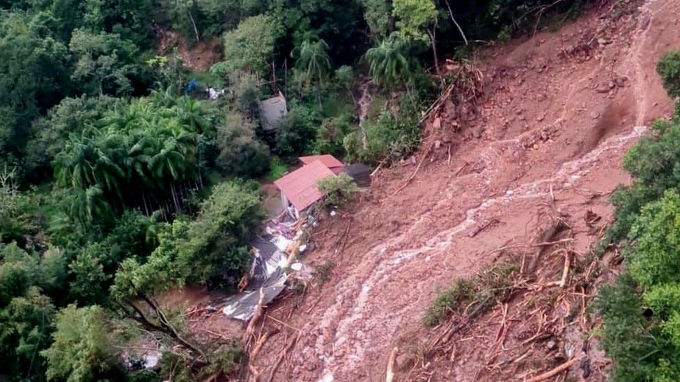 View of a house in a flooded area taken from a helicopter