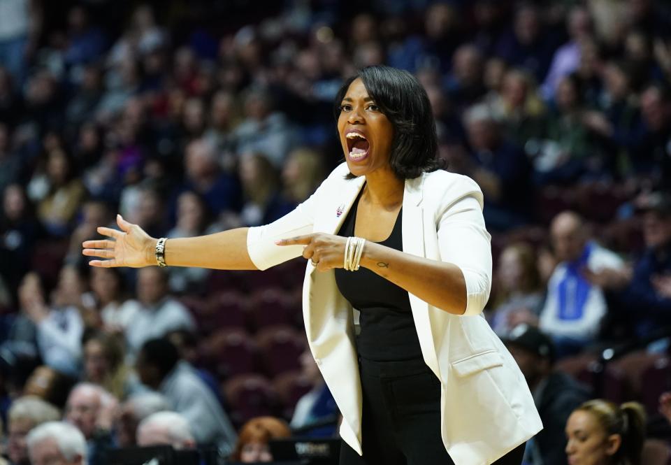 Providence women's basketball head coach Erin Batth calls out instructions from the sideline during a game in March against UConn at Mohegan Sun Arena.