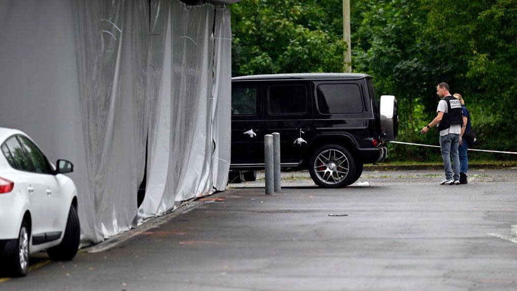 Police officers are at work on the site of a shooting that occured overnight during a wedding party in Thionville, eastern France, on June 30, 2024. 