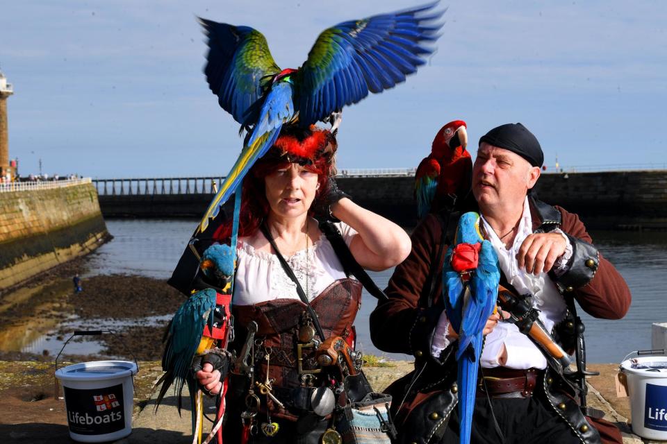 Tina Outram and Tony Dickinson from Pirates and Parrots, Hull, is pictured with their Parrots at the Pirate Festival at Whitby. Picture taken by Yorkshire Post Photographer Simon Hulme 2nd September 2023