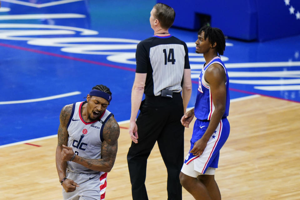 Washington Wizards' Bradley Beal, left, reacts after the Wizards fouled the 76ers during the second half of Game 5 in a first-round NBA basketball playoff series, Wednesday, June 2, 2021, in Philadelphia. (AP Photo/Matt Slocum)