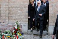 German President Frank-Walter Steinmeier, his wife Elke Budenbender and Saxony-Anhalt State Premier Reiner Haseloff leave the synagogue in Halle