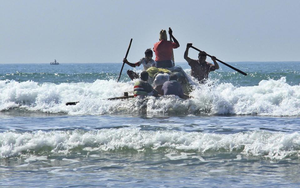 In this Jan. 16, 2017, photo, Rohingya fishermen launch a raft made of empty plastic containers to go fishing into the rough sea off of Tha Pyay Taw village, Maungdaw, western Rakhine state, Myanmar. Their usual, sturdy fishing boats were outlawed three months ago when Myanmar authorities launched a sweeping and violent counter-insurgency campaign in Rakhine state, home to the long-persecuted Rohingya Muslim minority. The ban on fishing boats _ meant to prevent insurgents from entering or leaving the country by sea _ is just one small provision in the wider crackdown, in which authorities have been accused of widespread abuses. (AP Photo/Esther Htusan)