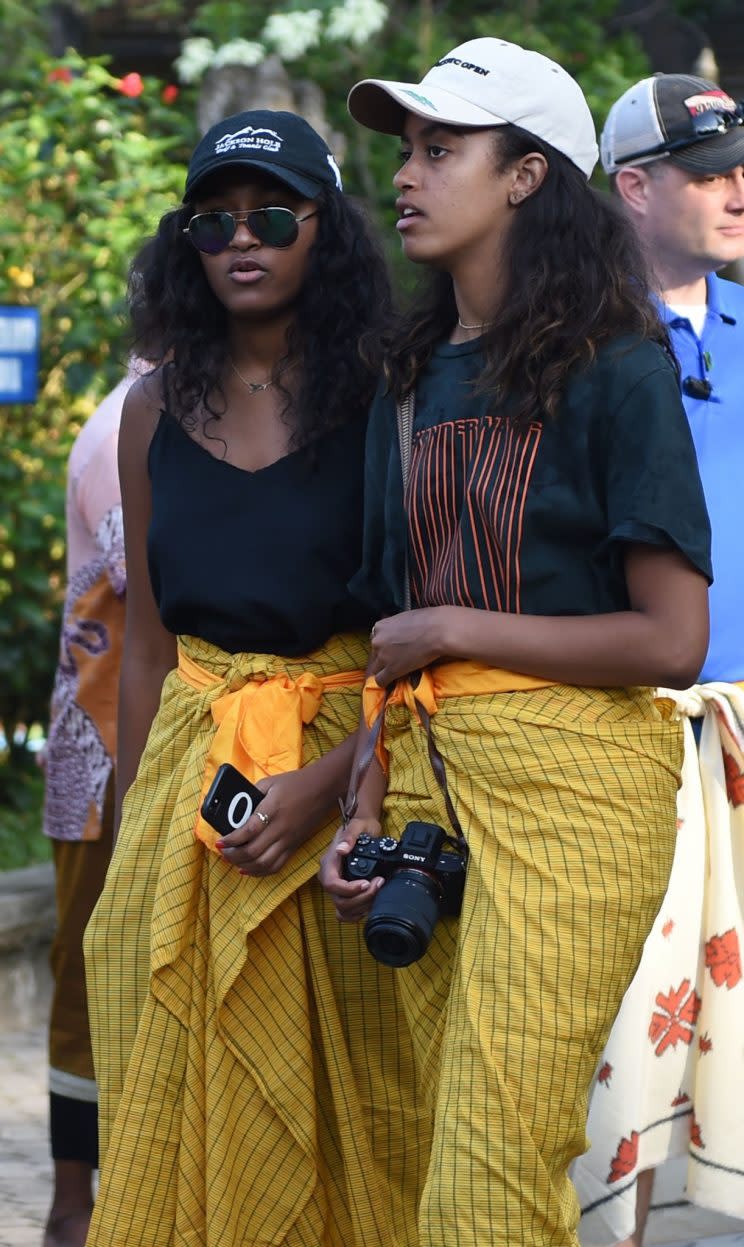 Sasha and Malia outside the temple.