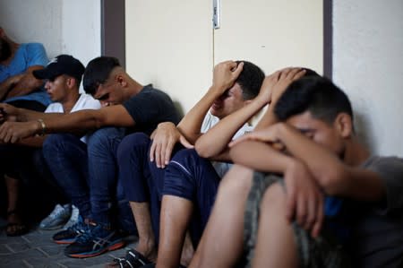 Relatives of Palestinian gunmen who were killed by Israeli forces as they tried to cross the Gaza border, react at a hospital in the northern Gaza Strip