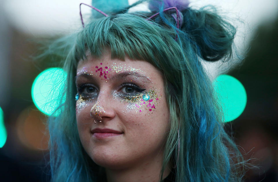 <p>A woman wears sparkle and green hair as members of the gay community and their supporters celebrate the result of a postal survey calling for gay marriage right in Sydney, Australia, Wednesday, Nov. 15, 2017. (Photo: Rick Rycroft/AP) </p>