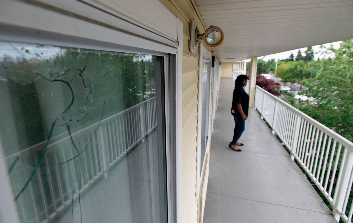 A bullte hole from a drive-by shooting as Janelle Wright passes on her duties as head housekeeper at the HomeTowne Studios hotel on Hosmer Street in Tacoma, Washington on July 8, 2022.