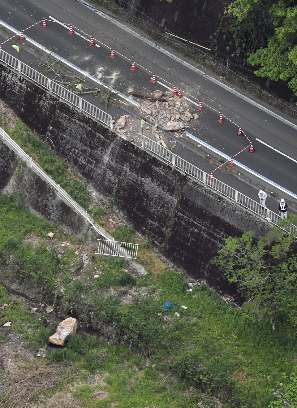 This shows the site of a rock fall following an earthquake in Ohzu, Ehime prefecture, western Japan Thursday, April 18, 2024. According to Kyodo News reports, a strong earthquake hit Ehime and Kochi prefectures in western Japan on Wednesday night, but no tsunami warning was issued. (Kyodo News via AP)