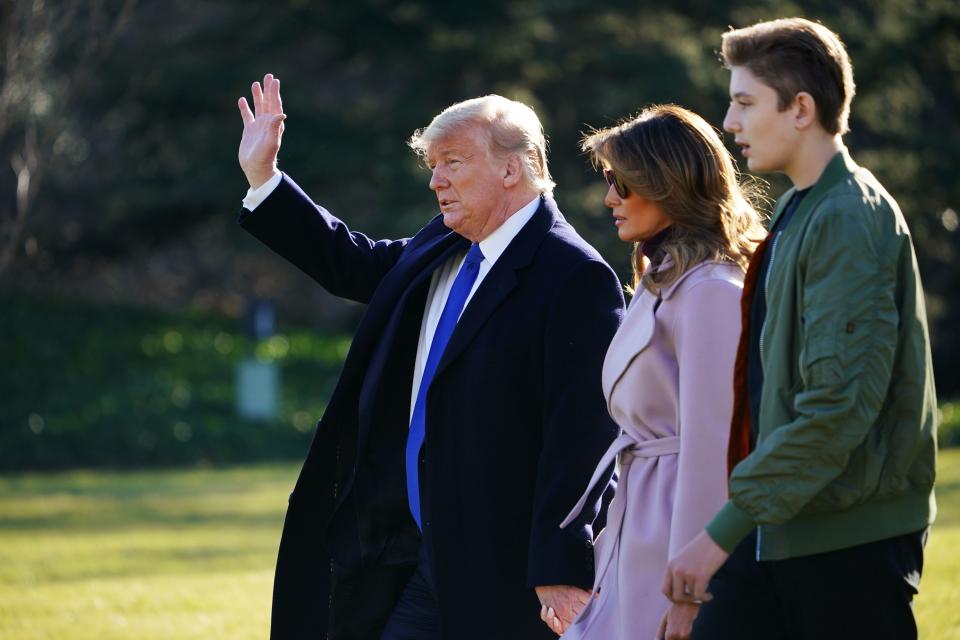 US President Donald Trump, First Lady Melania Trump and son Barron Trump make their way to board Marine One from the South Lawn of the White House in Washington, DC on January 17, 2020. - Trump is traveling to Palm Beach, Florida. (Photo by MANDEL NGAN / AFP) (Photo by MANDEL NGAN/AFP via Getty Images)