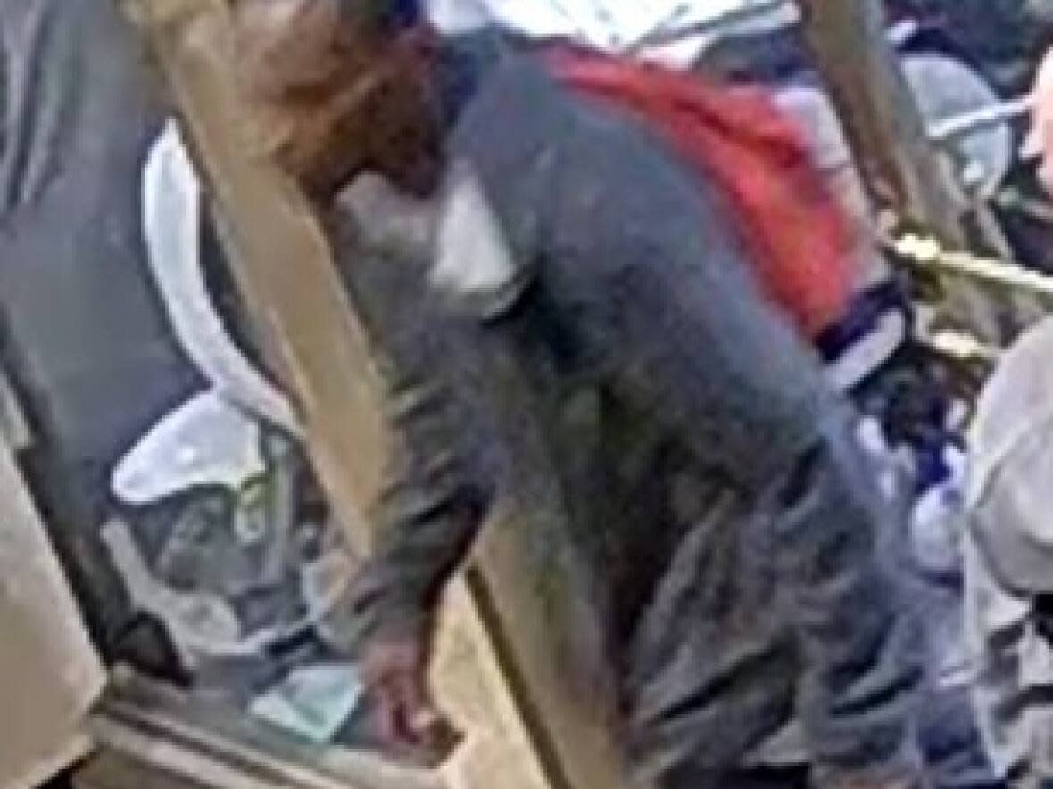 Toronto police have released this image of a man after a person in a wheelchair was assaulted downtown in a random attack last month. The victim was left with a laceration under the eye. (Submitted by Toronto Police Service - image credit)