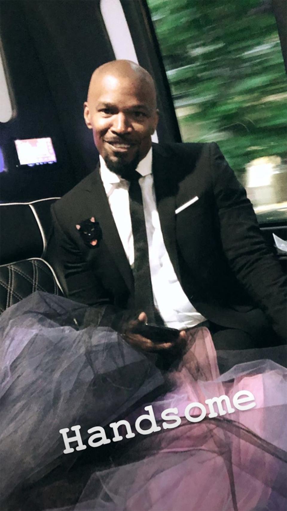 In fact, Zac Posen captured this shot of Jamie Foxx looking "handsome" on his way to the event. Handsome <em>and</em> handy - he's playing the role of train wrangler for Katie's major gown.