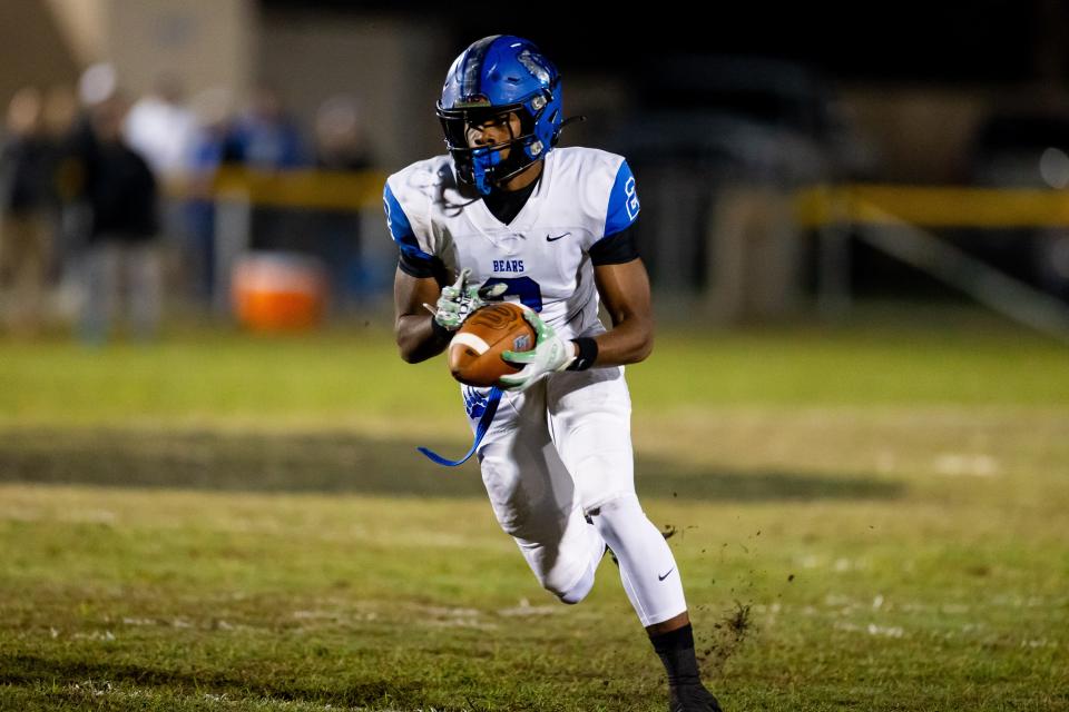 Bartram Trail's Arthur Lewis IV runs for yardage after a reception against Gainesville Buchholz in the 2023 playoffs.