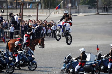 French Republican guards perform during the traditional Bastille Day military parade on the Champs-Elysees avenue in Paris, France, July 14, 2018. REUTERS/Charles Platiau