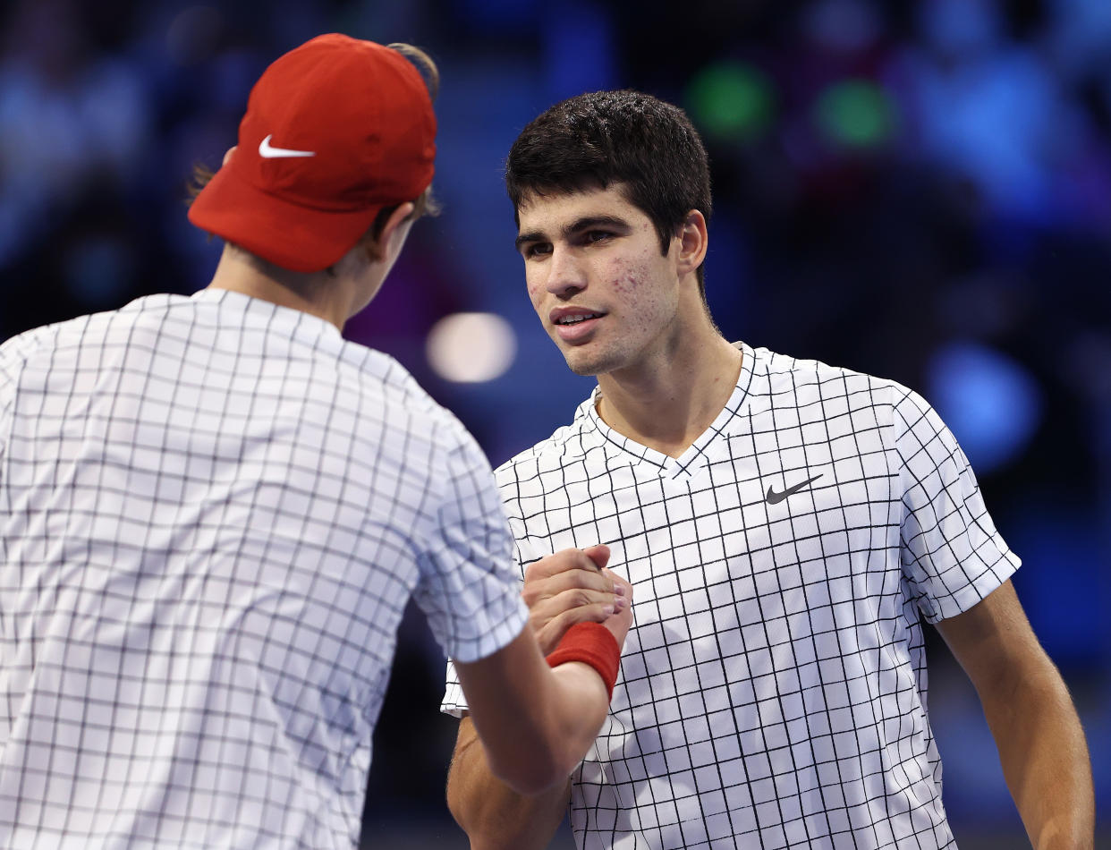 MILAN, ITALY - NOVEMBER 09:  Carlos Alcaraz of Spain is congratulated after his round robin match against Holger Vitus Nodskov Rune of Denmark during Day One of the Next Gen ATP Finals at Palalido Stadium on November 09, 2021 in Milan, Italy. (Photo by Julian Finney/Getty Images)