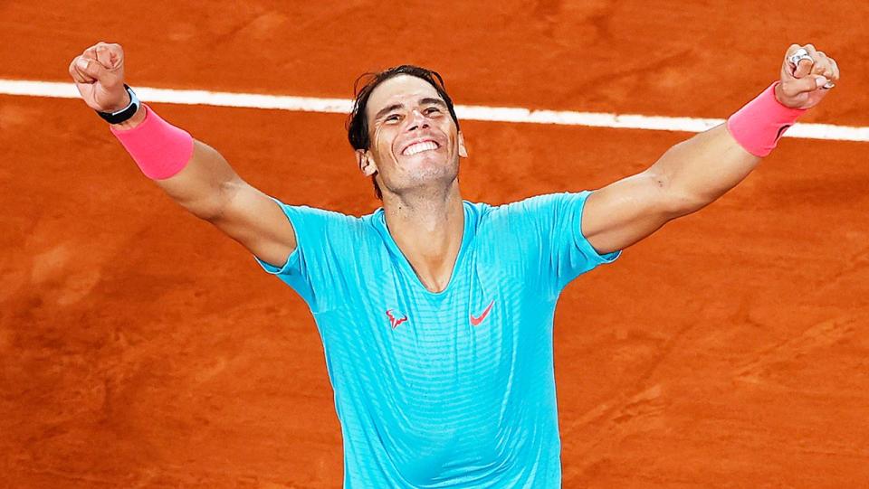 Rafa Nadal (pictured) throws his hands in the air as he celebrates winning the French Open.