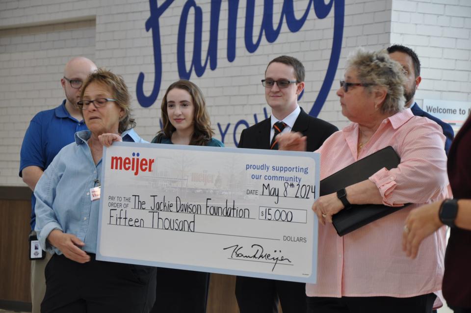 Jackie Monea and Kim Hardgrove, members of the Local Hope: The Jackie Davison Foundation, accepted a $15,000 donation from Meijer on May 8, 2024, during a North Canton store preview. The group helps women struggling with cancer and other medical issues.