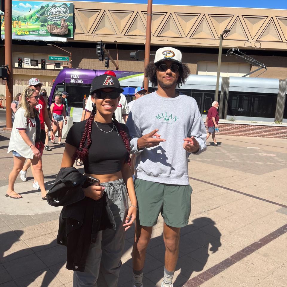 Chloe Merryweather and Chase Bracing pose for a photo outside Chase Field on Oct. 19, 2023.