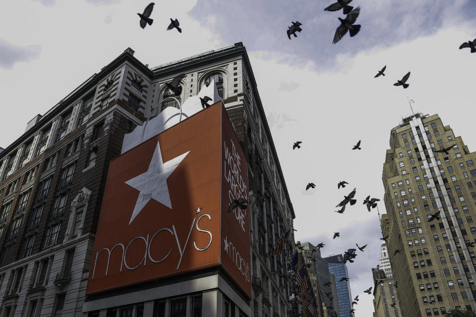 Macy's Herald Square store is shown with birds flying in the sky.