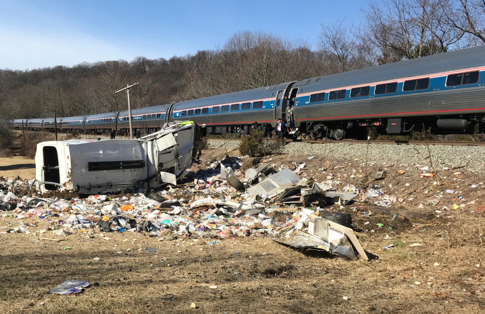 An Amtrak passenger train carrying Republican members of the U.S. Congress from Washington to a retreat in West Virginia is seen after colliding with a garbage truck in Crozet, Va., Jan. 31. (Photo: Justin Ide/Crozet Volunteer Fire Department/Handout via Reuters)