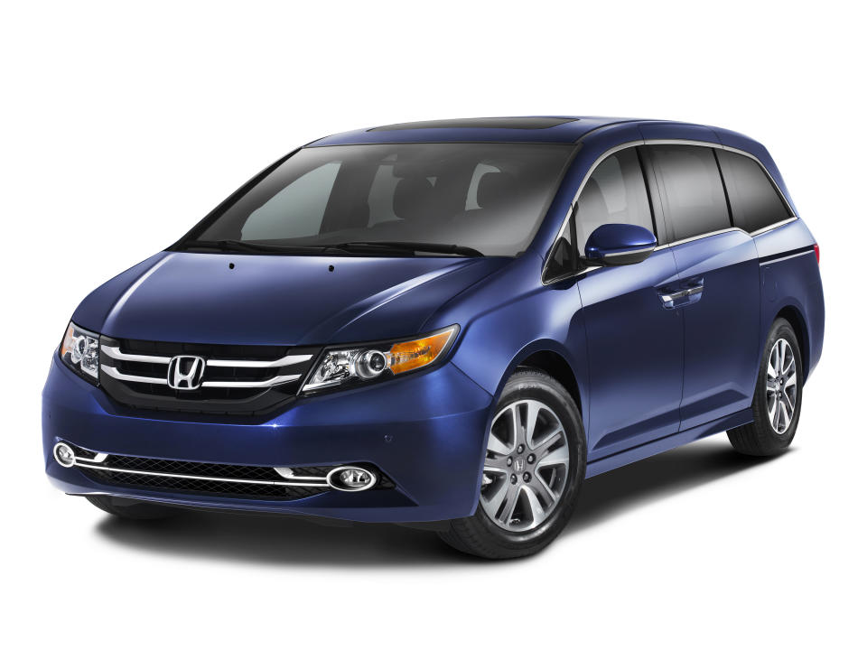 This publicity photo provided by American Honda Motor Co., Inc. shows the 2014 Honda Odyssey Touring Elite. The world’s first in-vehicle vacuum cleaner makes its debut on the updated 2014 Odyssey minivan. It's only available on the Touring Elite model, which starts at $44,450. (AP Photo/American Honda Motor Co., Inc.)