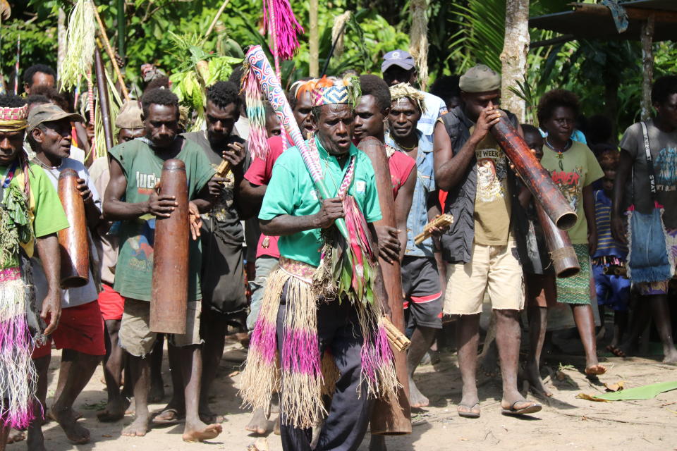 In this Nov. 29, 2019, photo, the Teau Community celebrates the Upe voting in the Bougainville referendum in Teau, Bougainville, Papua New Guinea. All across the Pacific region of Bougainville, people have been voting in a historic referendum to decide if they want to become the world’s newest nation by gaining independence from Papua New Guinea. (Jeremy Miller, Bougainville Referendum Commission via AP)